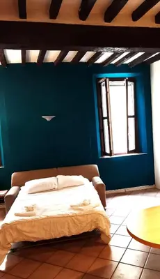 Letto o letti in una camera di Va Pensiero Cuore di Parma