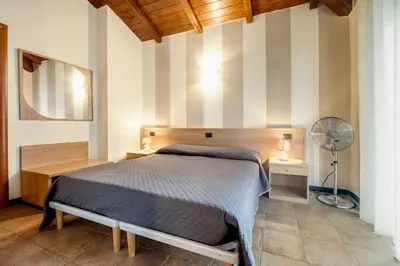 Letto o letti in una camera di 337 - Residence Montebello Monolocale E, Relax con Piscina e Giardino