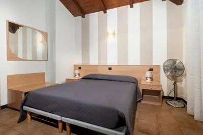 Letto o letti in una camera di 337 - Residence Montebello Monolocale E, Relax con Piscina e Giardino