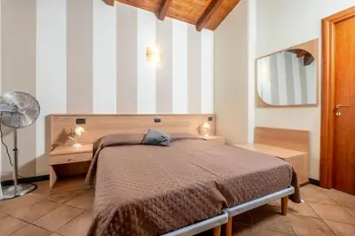 Letto o letti in una camera di 335 - Residence Montebello Monolocale C, Relax nel verde con Piscina