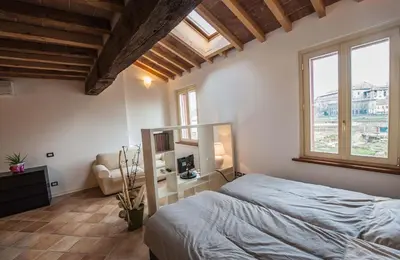 Letto o letti in una camera di B&B Le Grazie