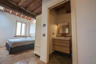 Letto o letti in una camera di B&B Le Grazie