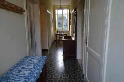 Letto o letti in una camera di Villa Rosa primo piano