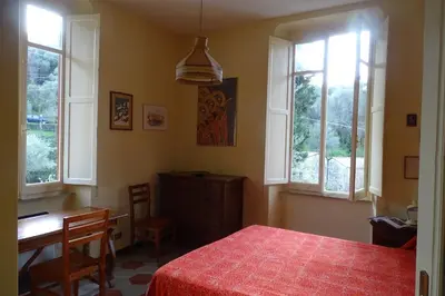 Letto o letti in una camera di Villa Rosa primo piano