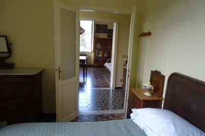 Letto o letti in una camera di Villa Rosa primo piano