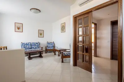 Area soggiorno di Appartamento Roberto-4 beds,AC