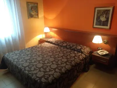 Letto o letti in una camera di Hotel Due Fontane