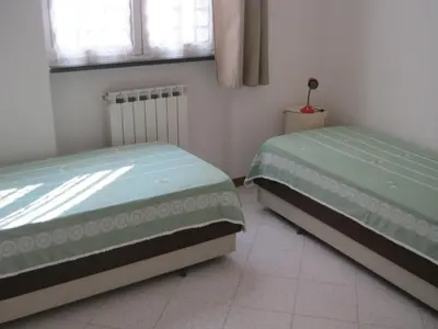 Letto o letti in una camera di VICINO AL MARE E A PORTOFINO - NEXT TO THE SEA And PORTOFINO