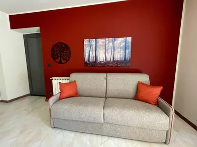 Area soggiorno di Apartment 'Il Bosco' mit Terrasse by Interhome