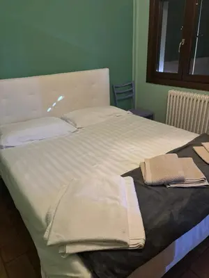 Letto o letti in una camera di Rifugio Della Pietra