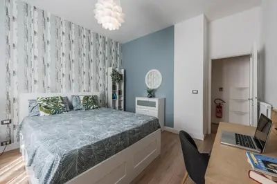 Letto o letti in una camera di La Casa di Parma - Strategic Location