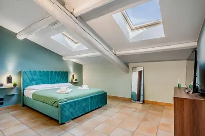 Letto o letti in una camera di Casa Mameli in The Heart of City