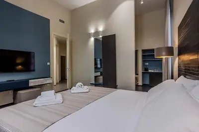 Letto o letti in una camera di Salina Luxury Suites