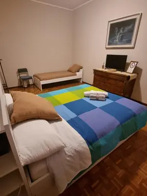 Letto o letti in una camera di Casa Fenice