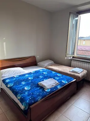 Letto o letti in una camera di Soldi 17 Cremona Stadio