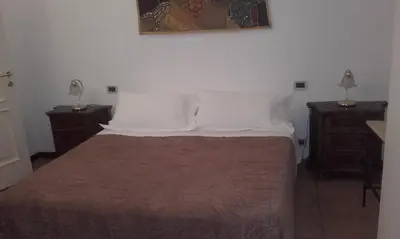 Letto o letti in una camera di Appartamento Giardino Verde