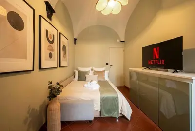 Letto o letti in una camera di Rapallo City Center Steps from the Sea AC Wi-Fi Parking
