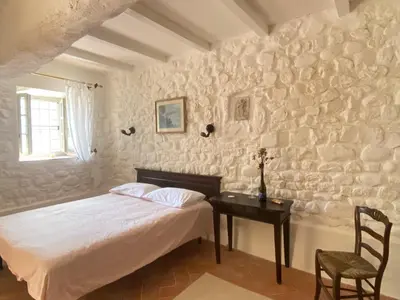 Letto o letti in una camera di Casa Rosmarino Malgrate