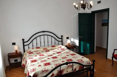 Letto o letti in una camera di Tana Degli Orsi