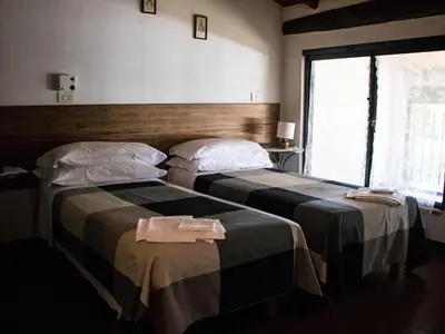 Letto o letti in una camera di Locanda Casa Motta