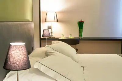 Letto o letti in una camera di Smart Hotel