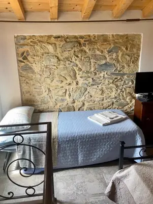 Letto o letti in una camera di Casa Dell'Angelo