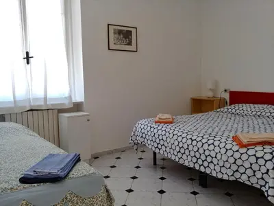 Letto o letti in una camera di Casa Auxilium