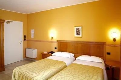 Letto o letti in una camera di Hotel Ristorante Novecento