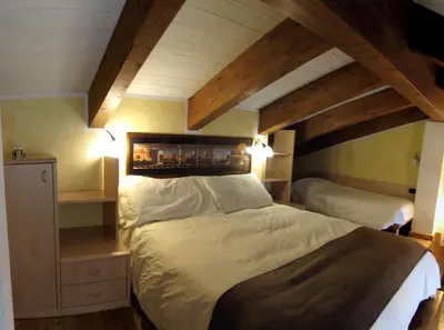 Letto o letti in una camera di La Baita D'Oro Ristorante Residence