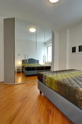 Letto o letti in una camera di My House Apartments