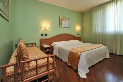 Letto o letti in una camera di Hotel Le Ville