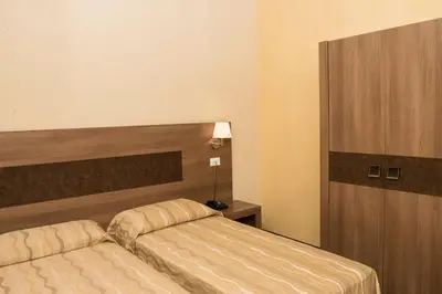 Letto o letti in una camera di Hotel Corte Business