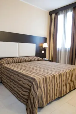 Letto o letti in una camera di Hotel Corte Business