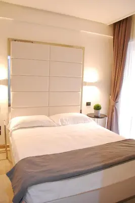 Letto o letti in una camera di LHP Suite Rapallo