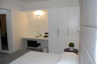 Letto o letti in una camera di LHP Suite Rapallo