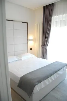 Letto o letti in una camera di LHP Suite Rapallo