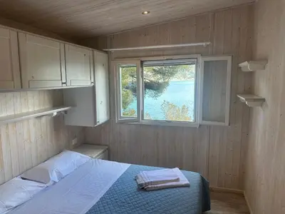 Letto o letti in una camera di Villaggio Smeraldo