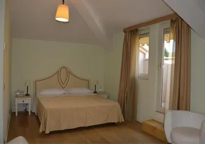Letto o letti in una camera di Grand Hotel Regina Salsomaggiore