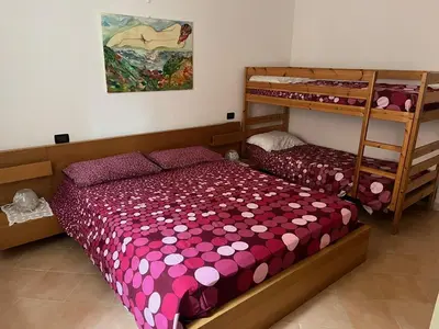 Letto o letti in una camera di Appartamento vicino al mare