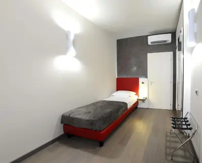 Letto o letti in una camera di B&B Opera
