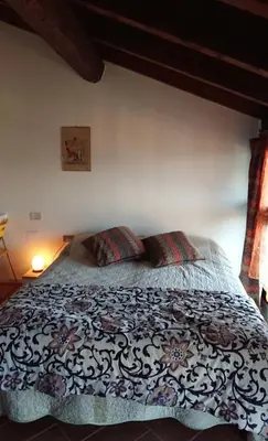 Letto o letti in una camera di B&B IL Loto BIKE FRIENDLY