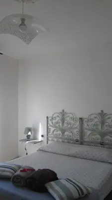 Letto o letti in una camera di B&B Agorà Sarzana