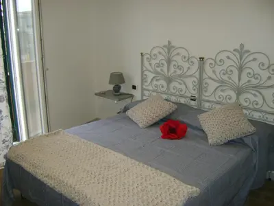 Letto o letti in una camera di B&B Agorà Sarzana