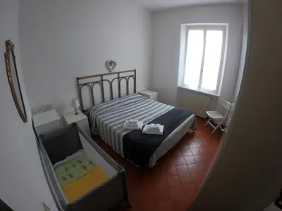 Letto o letti in una camera di A pochi passi dal mare by PortofinoVacanze
