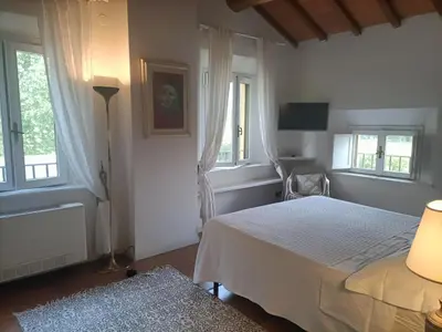 Letto o letti in una camera di La Villa delle Rose