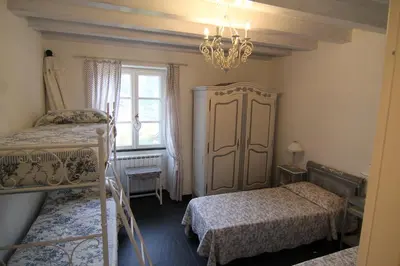 Letto o letti in una camera di 5 Lands Yellow Cottage