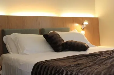 Letto o letti in una camera di Hotel Abetaia
