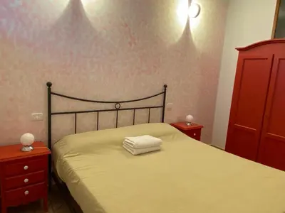 Letto o letti in una camera di Mini Appartamenti Nonna Nella