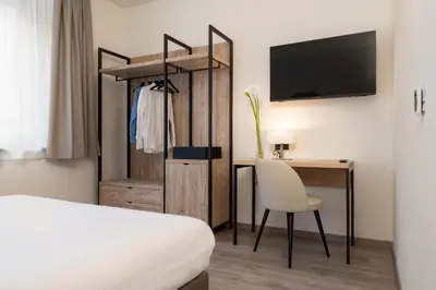 Letto o letti in una camera di Hotel Plaza