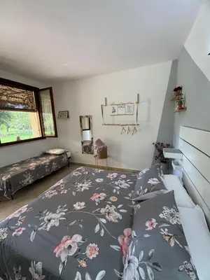 Letto o letti in una camera di Agriturismo Corte San Girolamo